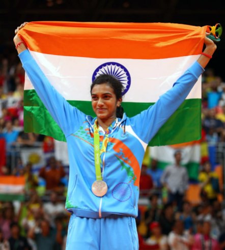 1_PV Sindhu with National Flag after winning silver medal at Rio Olympics