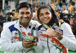 6_Sakshi Malik with Coach Shyam Budaki after winning Silver Medal at Rio Olympics_2